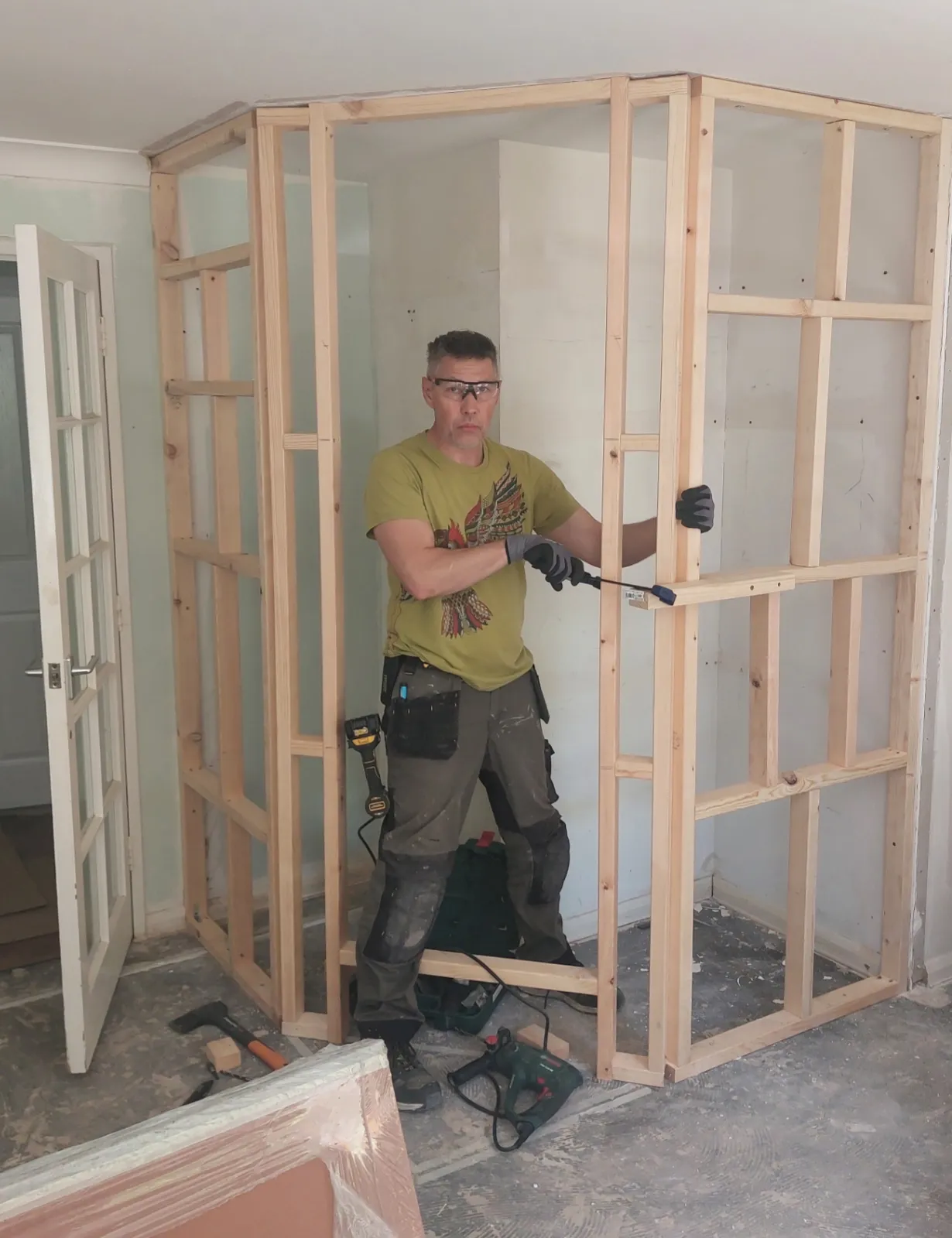 Dmytro constructing the cupboard