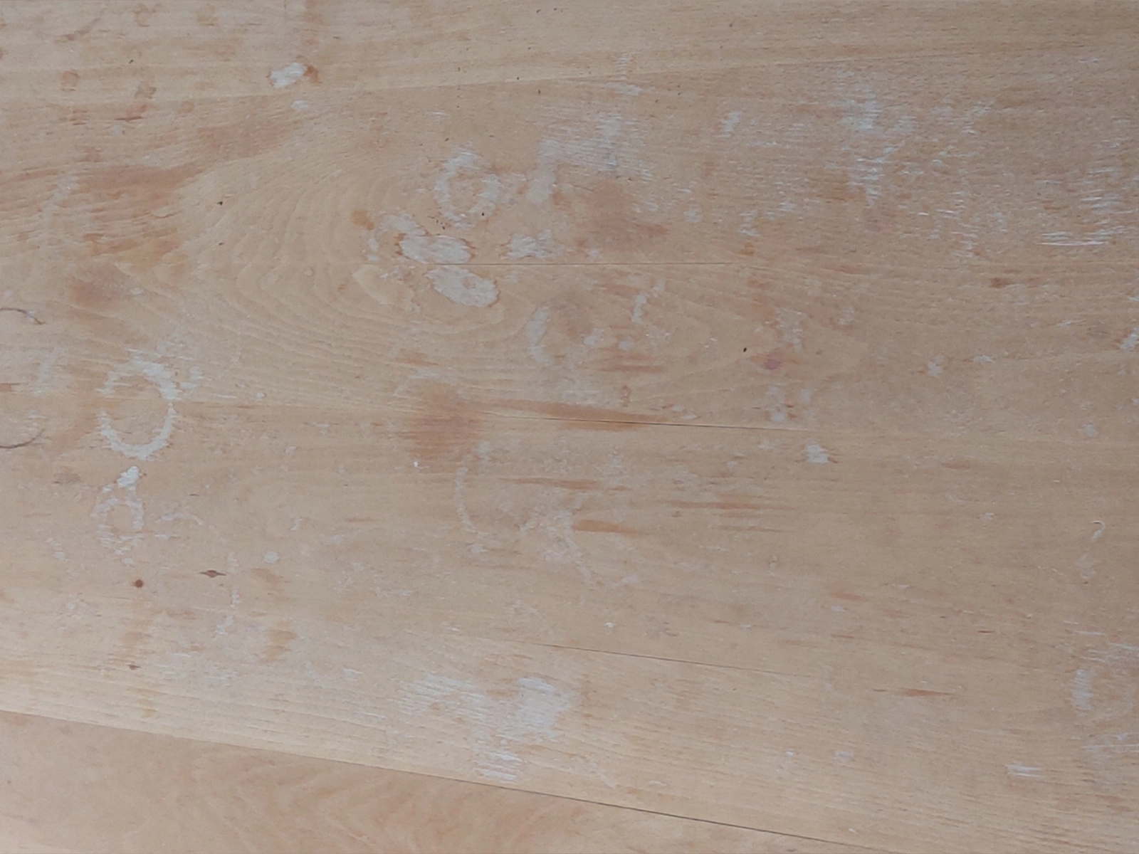 Before and after montage showing the dining table restoration