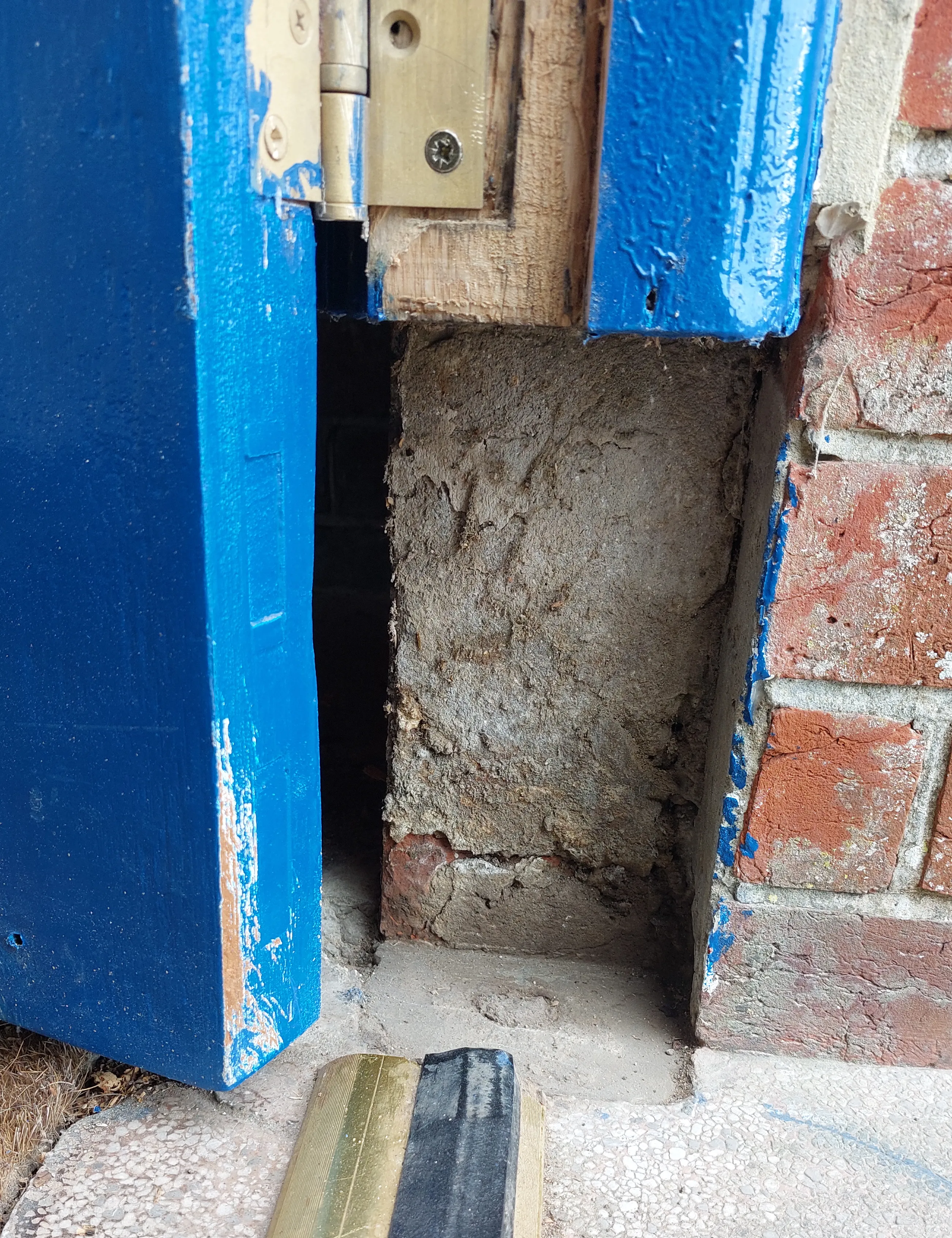 Rotten lower section removed from entrance door frame