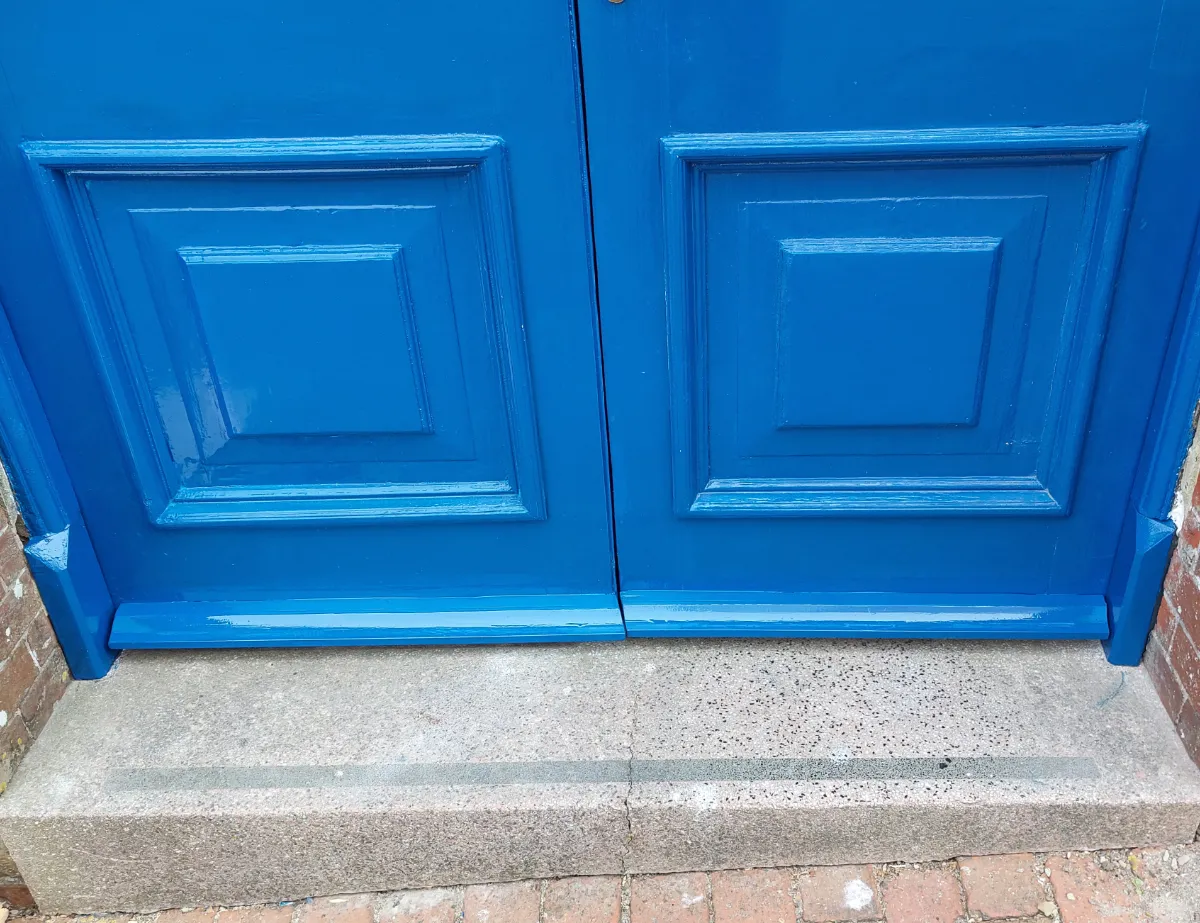Repaired entrance door frame after painting