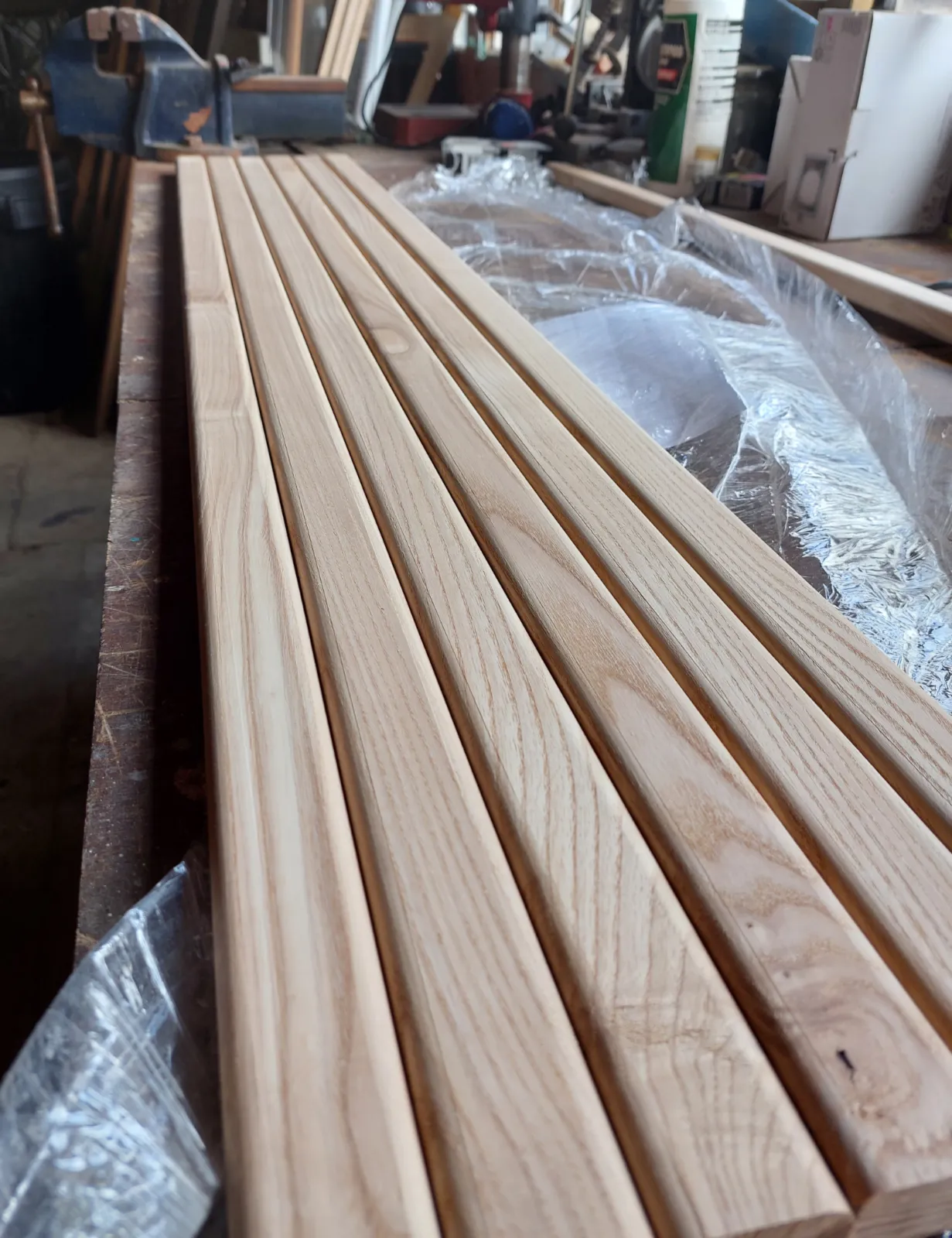 New timber seating being prepared for restored garden furniture