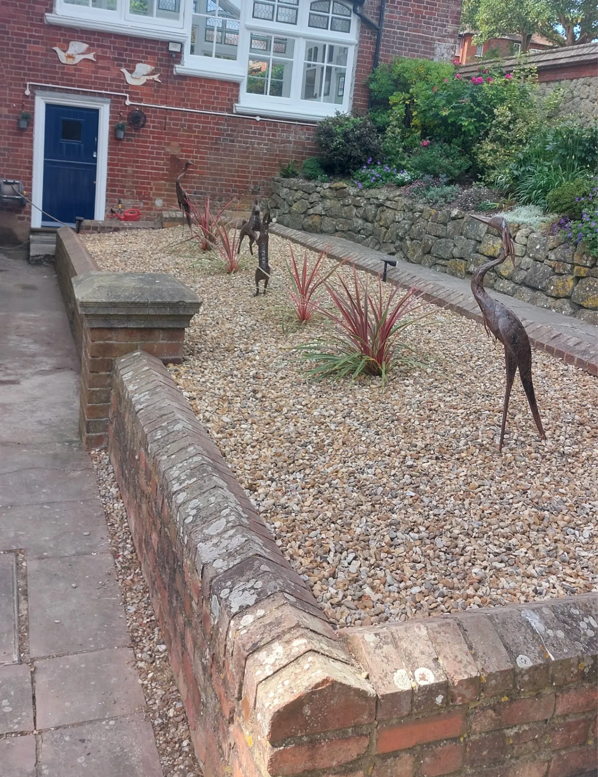 Completed decorative garden shingle bed