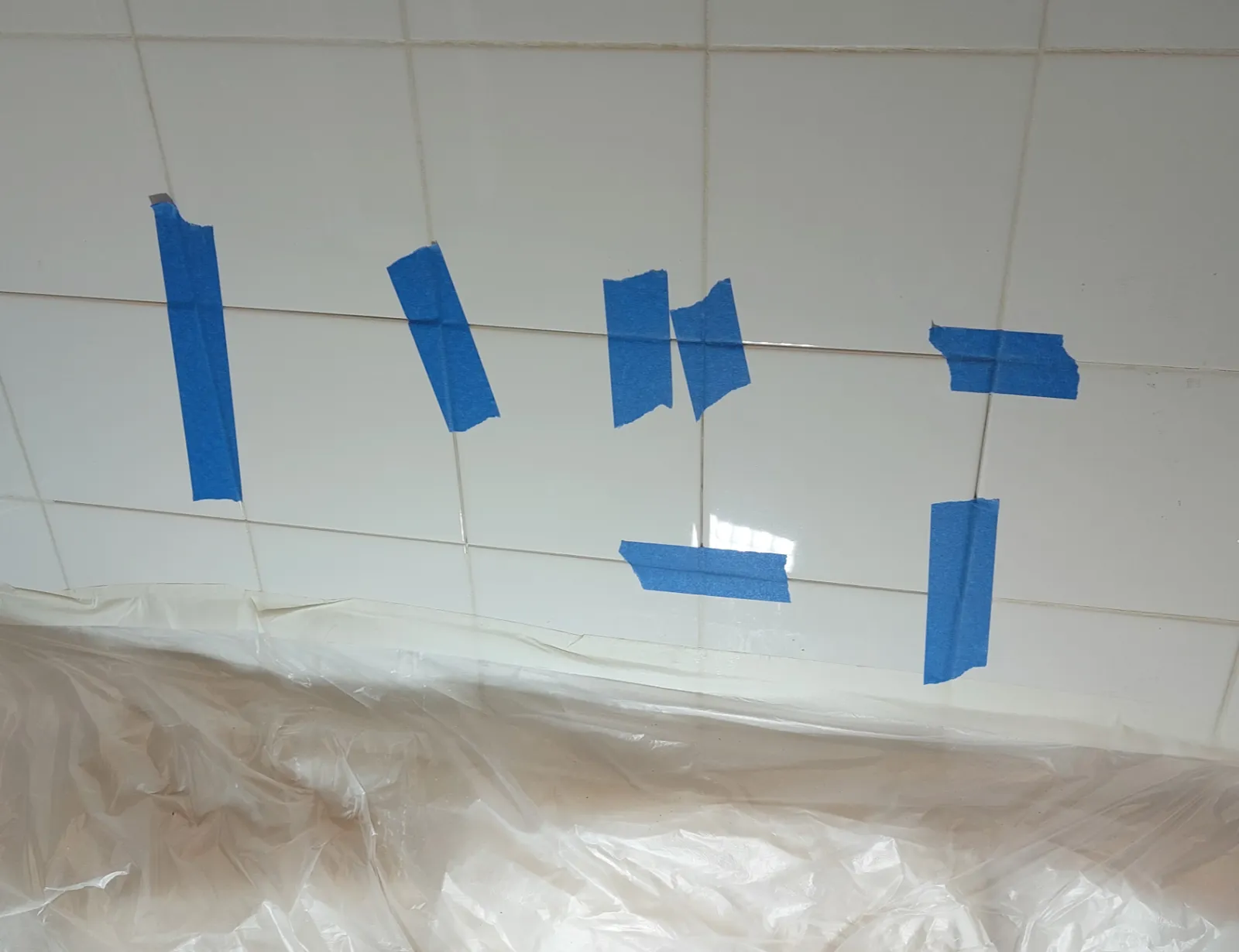 Bathroom tile repair in progress