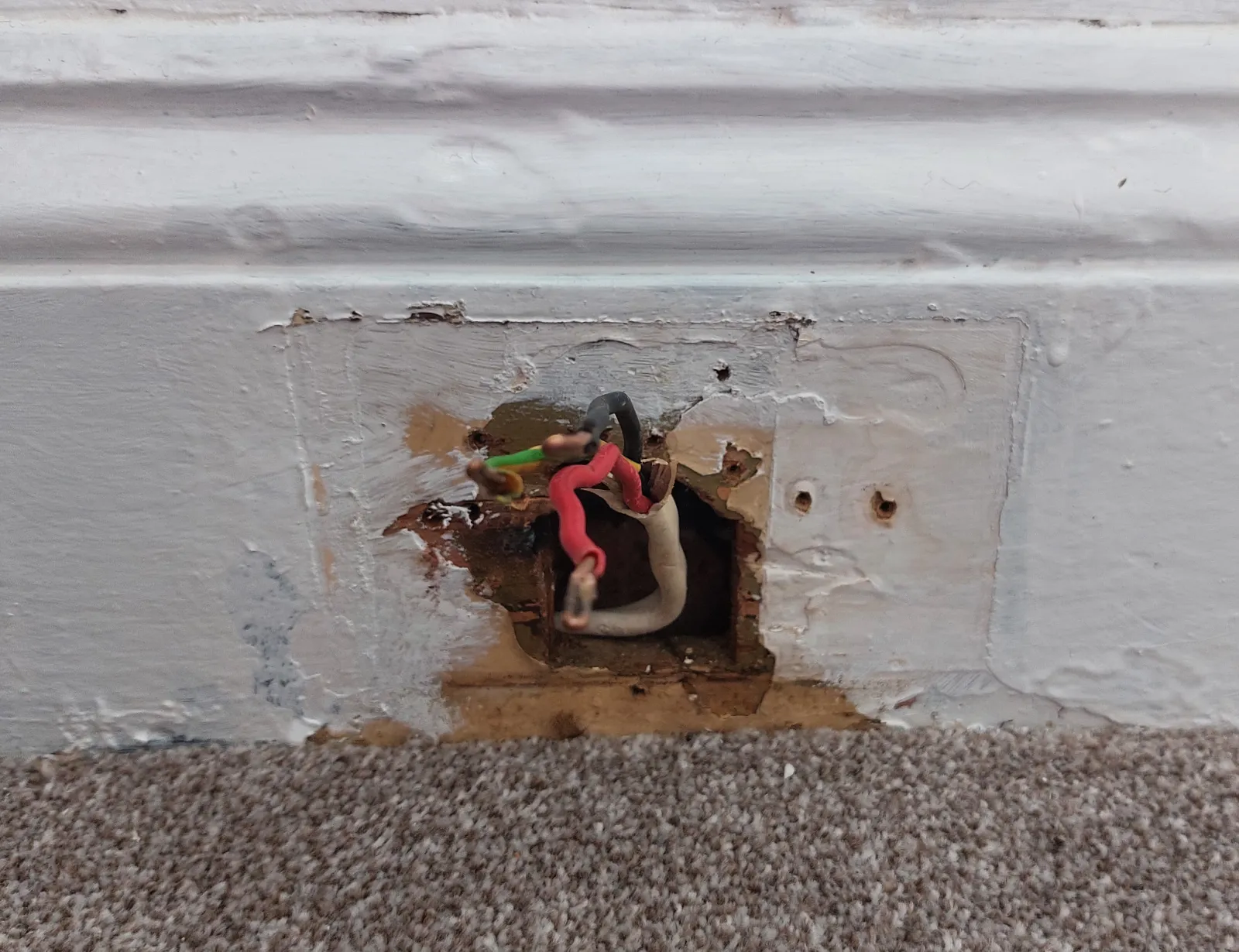 Damaged skirting board before repair