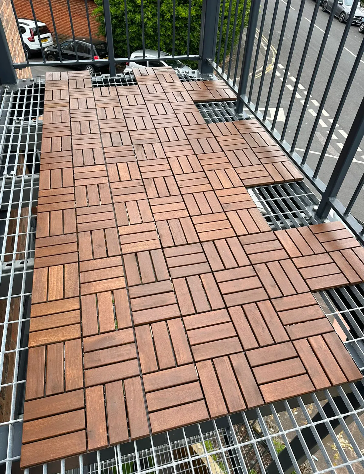 Veranda decking tiles fitted around the structure