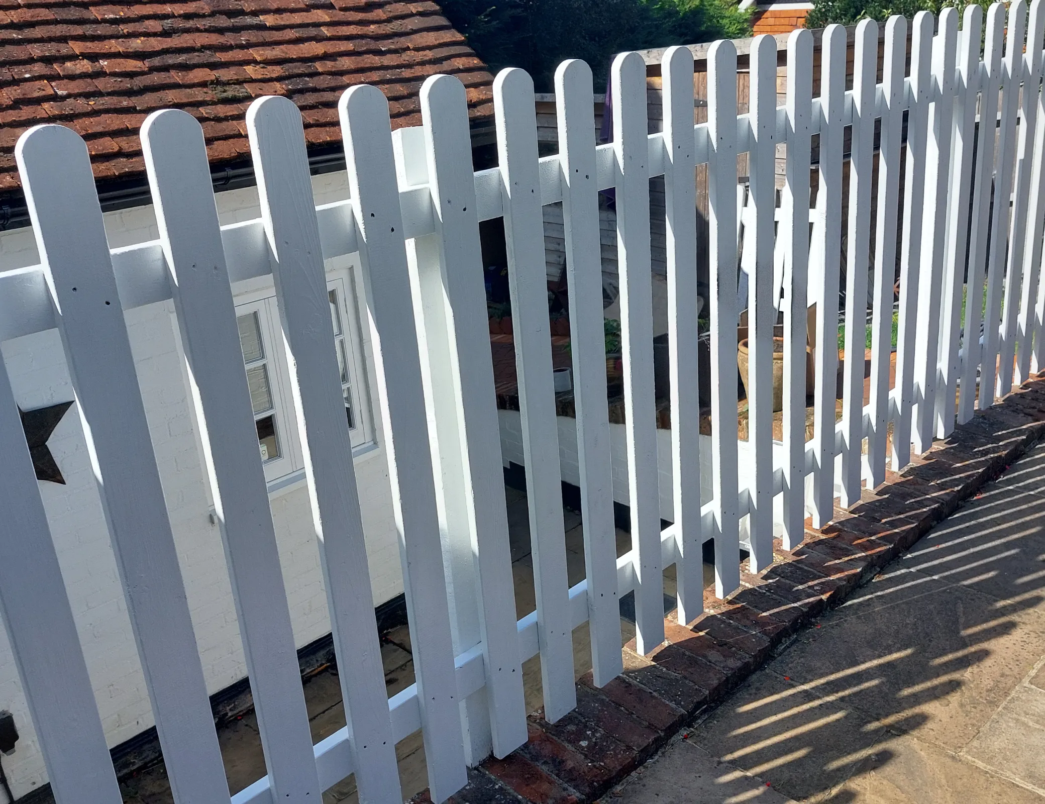 Garden fence maintenance in progress